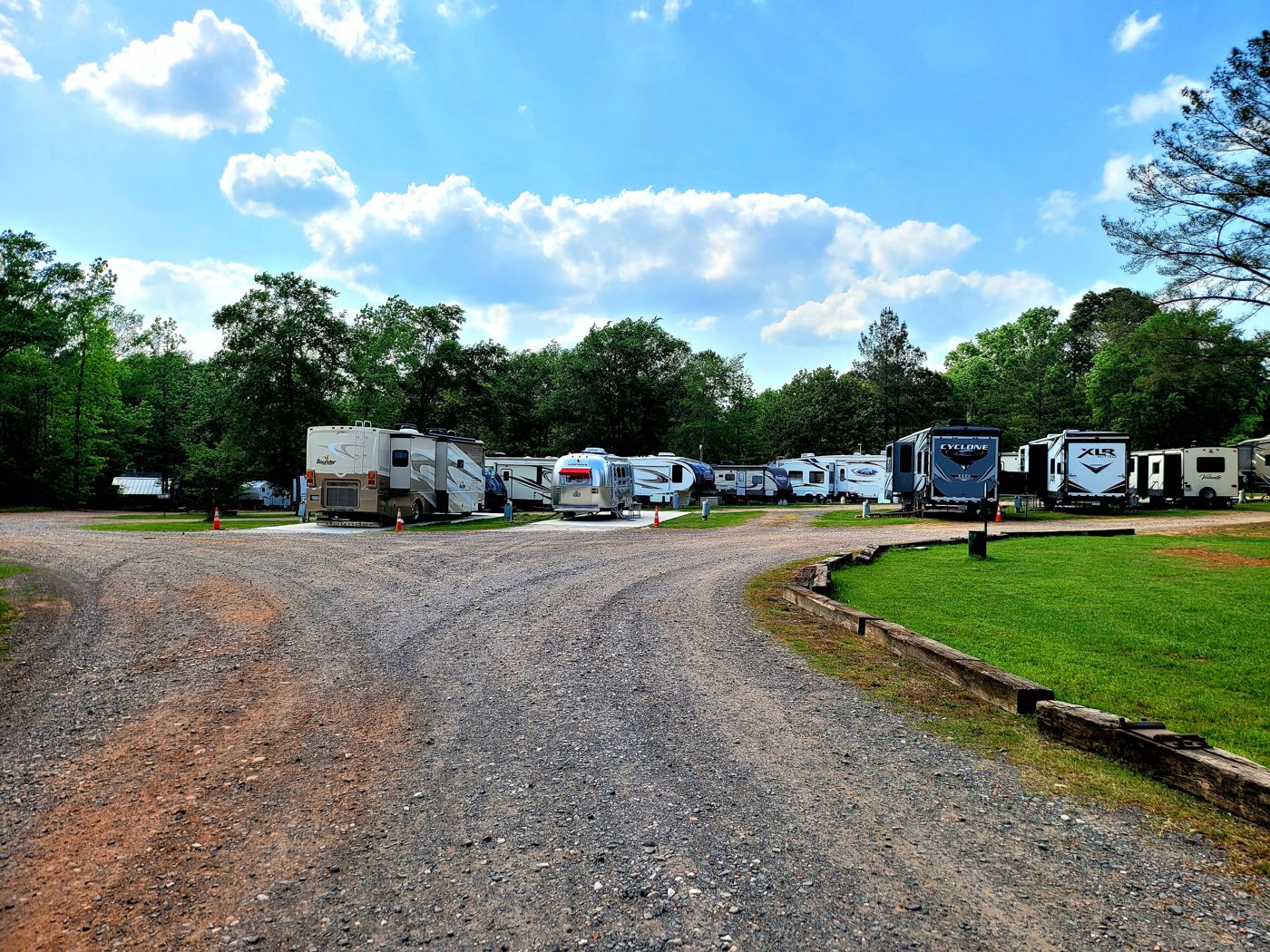 Gravel loop road with RVs under the pines