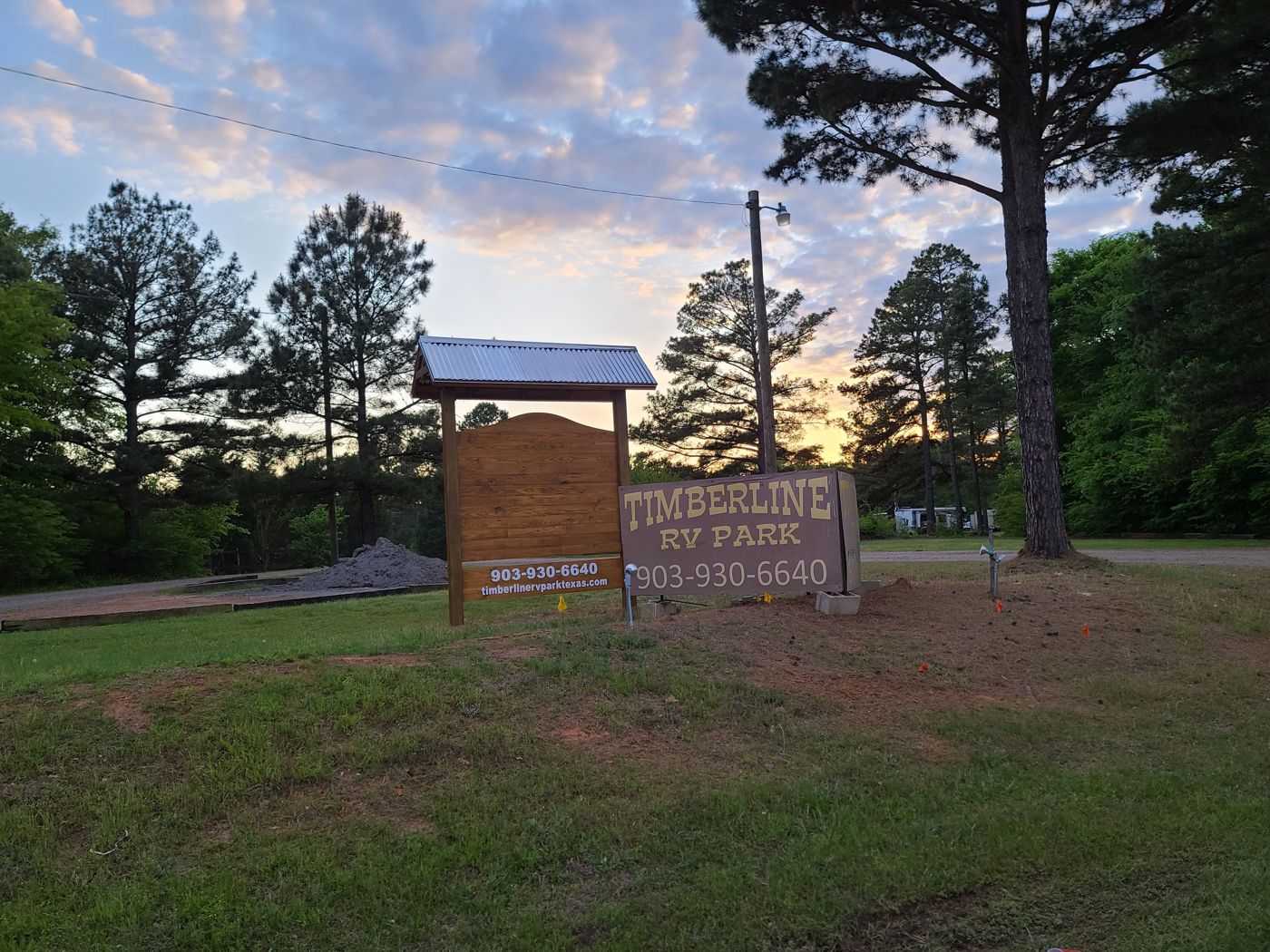 Timberline RV Park entrance sign at sunset